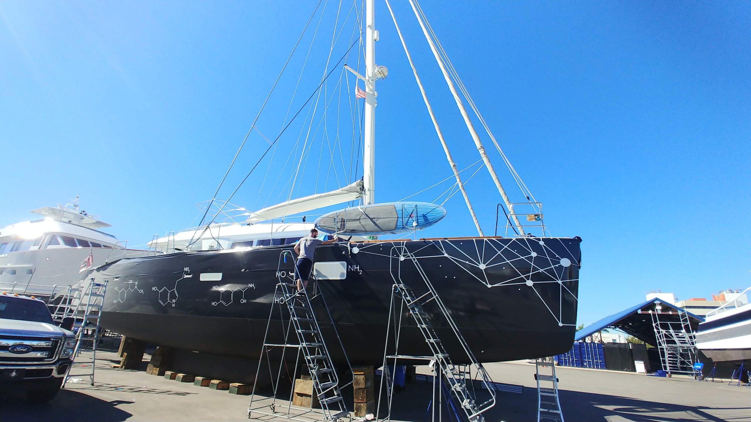 Vinyl Boat Wrap Installation On a Catamaran